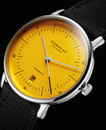 popup|Yellow, domed dial|Grey hands and a framed date together with the satin-finish dial round off the reduced overall appearance
