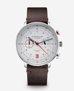 popup|Inspired by the regatta chronographs of the 70s..|..clear lines and the satin-finished dial lend a timeless elegance. Details such as the red chrono hand and the red date window add a sporty touch.