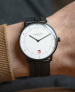 popup|Matthias has a wrist circumference of 18.5 cm/7,2 in|The new SuperSlim metal bracelet with black PVD coating.