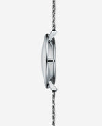 popup|Fits under every shirt sleeve|The particularly flat case construction makes the Naos Quartz the perfect dress watch for everyday wear.