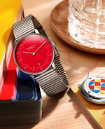 popup|Straight-lined segment strap|The new segment strap made of brushed, rustproof stainless steel is restrained due to its straight lines and emphasizes the colorful dial. It fits wonderfully around your wrist and can be individually adjusted to your desired length.