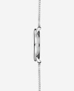 popup|Fits under any shirt sleeve|The particularly flat case construction makes the Naos the perfect dress watch for everyday wear.
